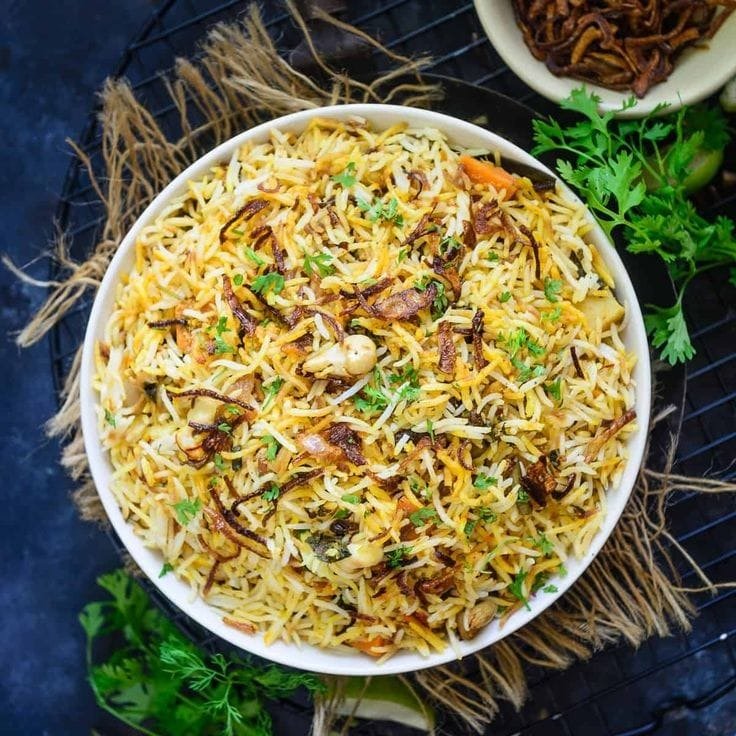 Hyderabadi Vegetable Biryani garnished with fried onions and coriander